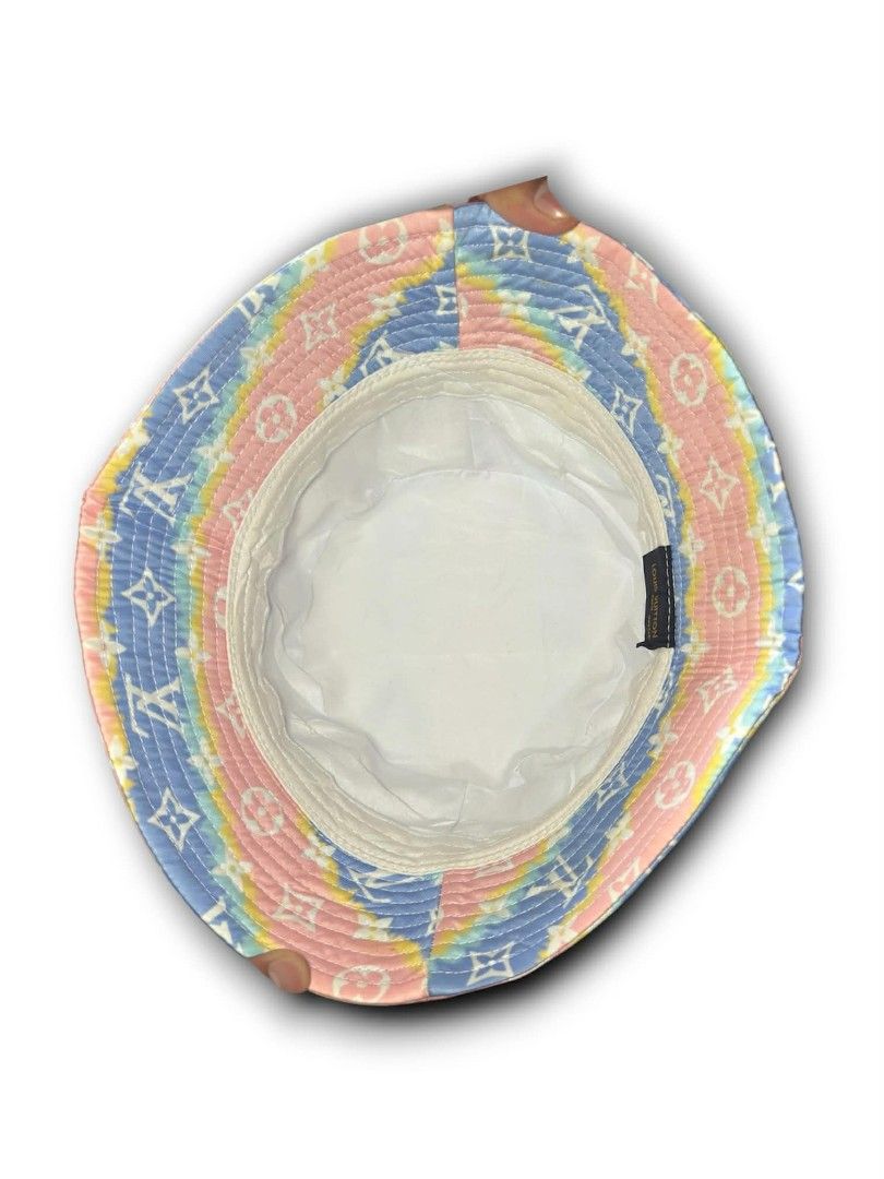 Louis Vuitton Rainbow Tie-Dye Monogram Bucket Hat (Category: Luxury Accessories) located in Cebu City. Submitted by westleygics18 (Listing ID 1434512515, Image 3). Description: Louis Vuitton Rainbow Tie-Dye Monogram Bucket Hat - Excellent Condition - Pastel rainbow tie-dye background with white signature monogram symbols. - Style: Classic bucket hat silhouette. - Material: Lightweight, smooth-finish fabric. - Interior: Solid white lining. Dm me f