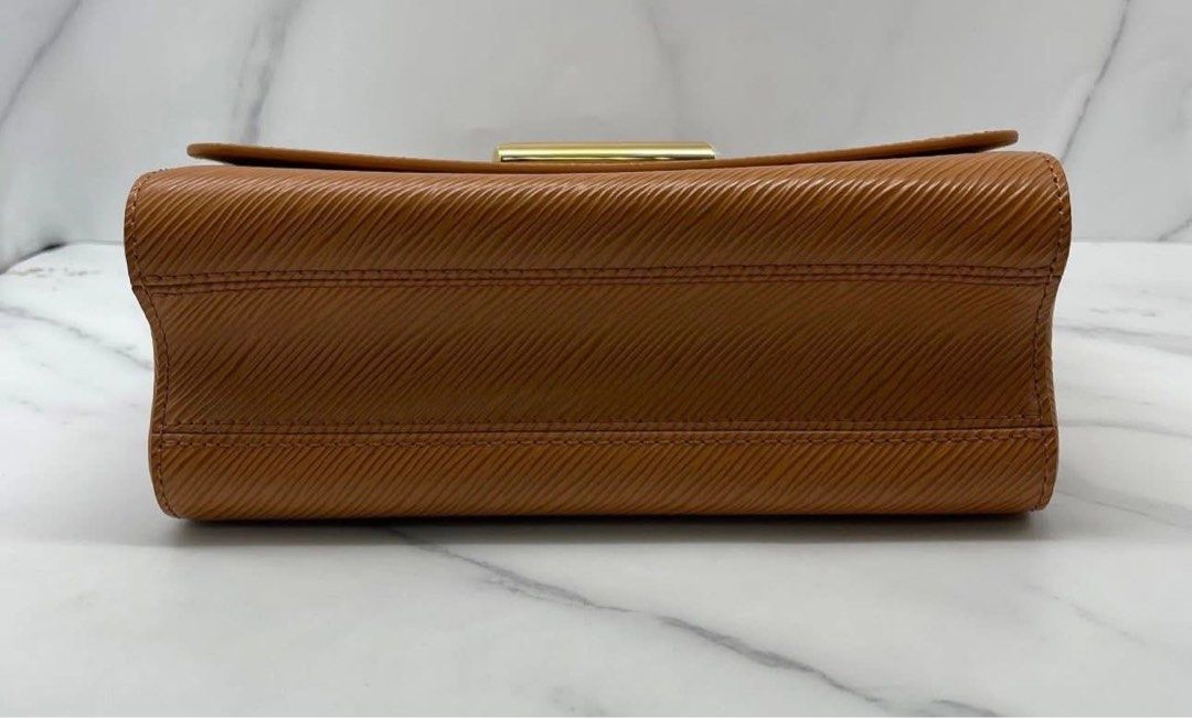 Louis Vuitton Twist PM Epi Leather Bag (Category: Luxury Bags & Wallets) located in Quezon City. Submitted by curatedbyamethyst (Listing ID 1434599843, Image 3). Description: - Authentic Louis Vuitton Twist PM. - Crafted from tan Epi leather. - Signature LV twist lock. - Gold-toned hardware. - Chain strap with leather shoulder pad. - Interior: Two compartments and a slip pocket..