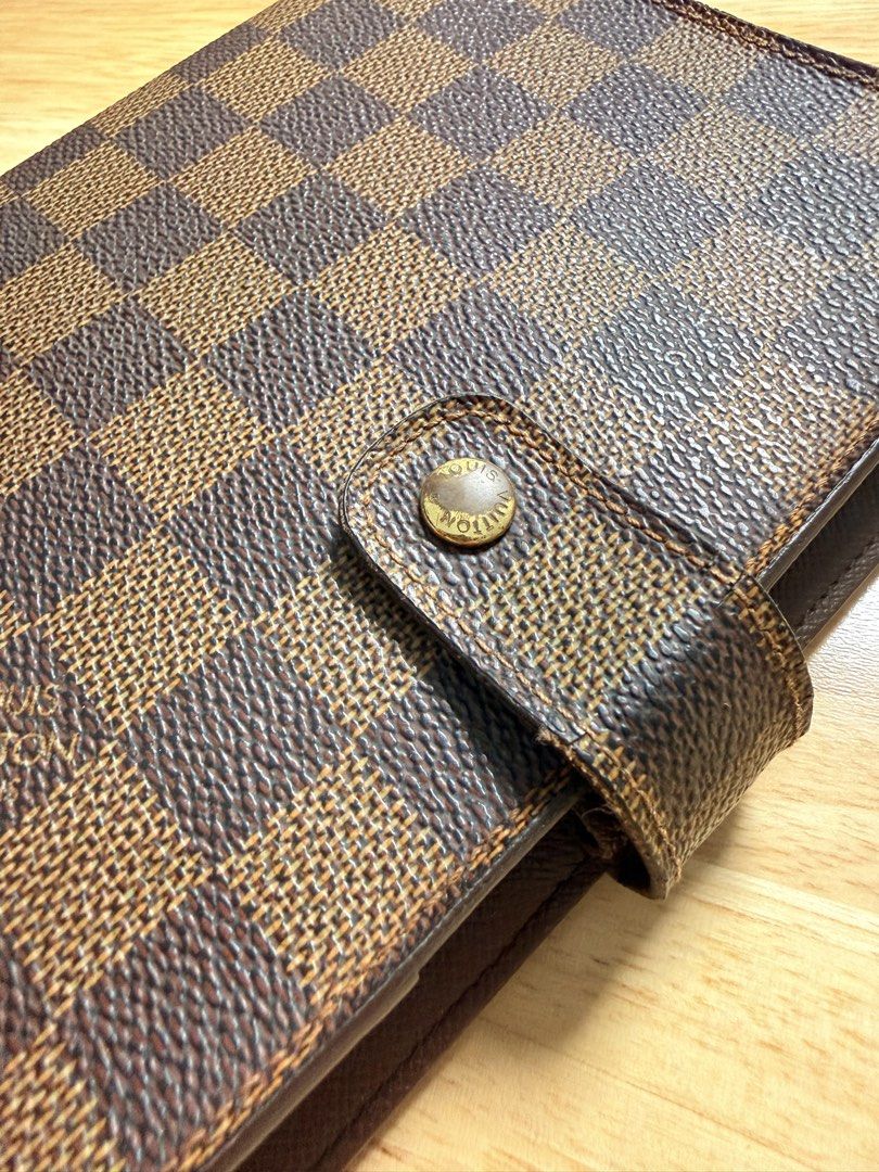 LV Agenda MM in Damier Ebene (Category: Luxury Bags & Wallets) located in Antipolo. Submitted by shopfromdawn (Listing ID 1434408526, Image 2). Description: Selling my preloved LV Agenda MM in Damier Ebene (genuine) Some tarnishings and signs of use evident, otherwise in very good used condition 🙂 Selling for p19,000 negotiable only for sure buyer Can include some blank filofax/moterm inserts *Send me a message if interested, can provide a detai