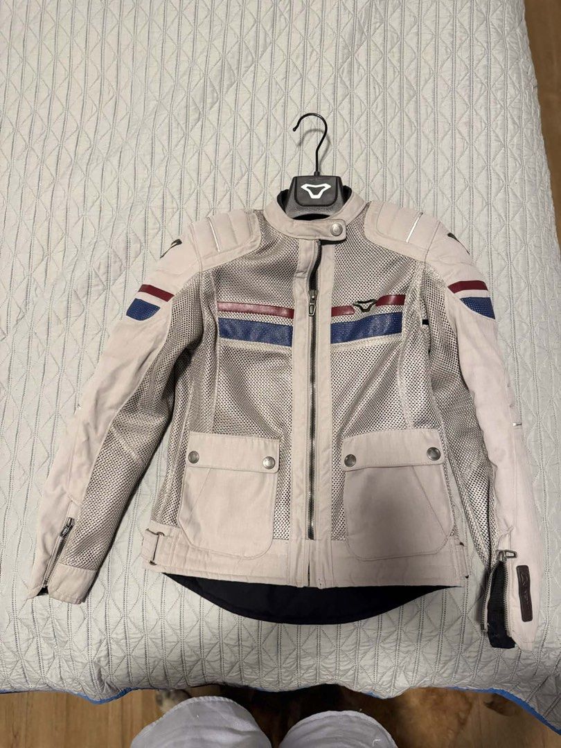 Macna Motorcycle Jacket - Women's Size S (Category: Coats, Jackets and Outerwear) located in Makati City. Submitted by phyles20 (Listing ID 1434537152, Image 2). Description: - Macna motorcycle jacket for women - Size: S - Design: Mesh with beige and blue accents - Features: Two front pockets, zipper closure - Inner lining: Black - Includes hanger.