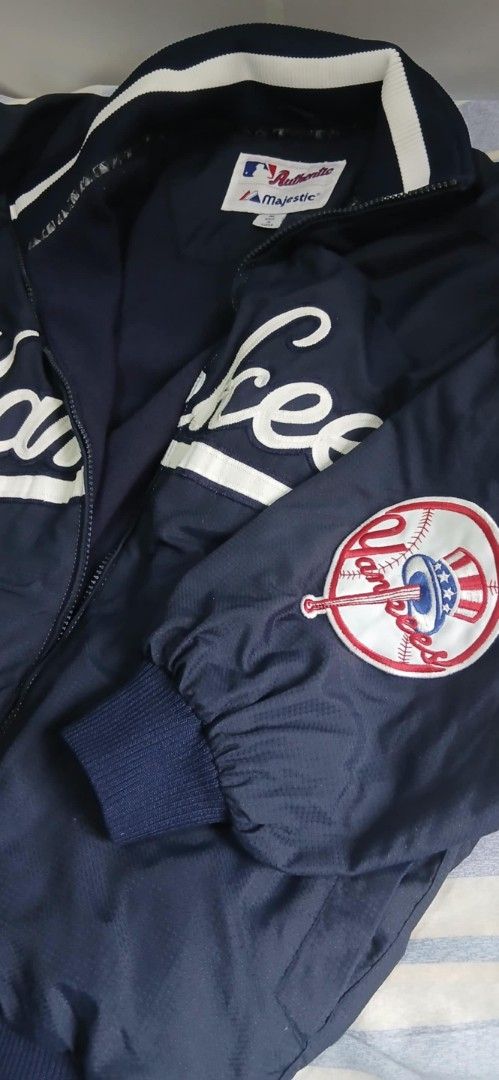 Majestic New York Yankees Jacket (Category: Coats, Jackets and Outerwear) located in Manila. Submitted by suyomjrsam92689 (Listing ID 1434524510, Image 2). Description: - Authentic Majestic New York Yankees jacket - Navy blue exterior with white accents - Prominent Yankees logo on chest and sleeve - Full zip closure - Made in Korea.