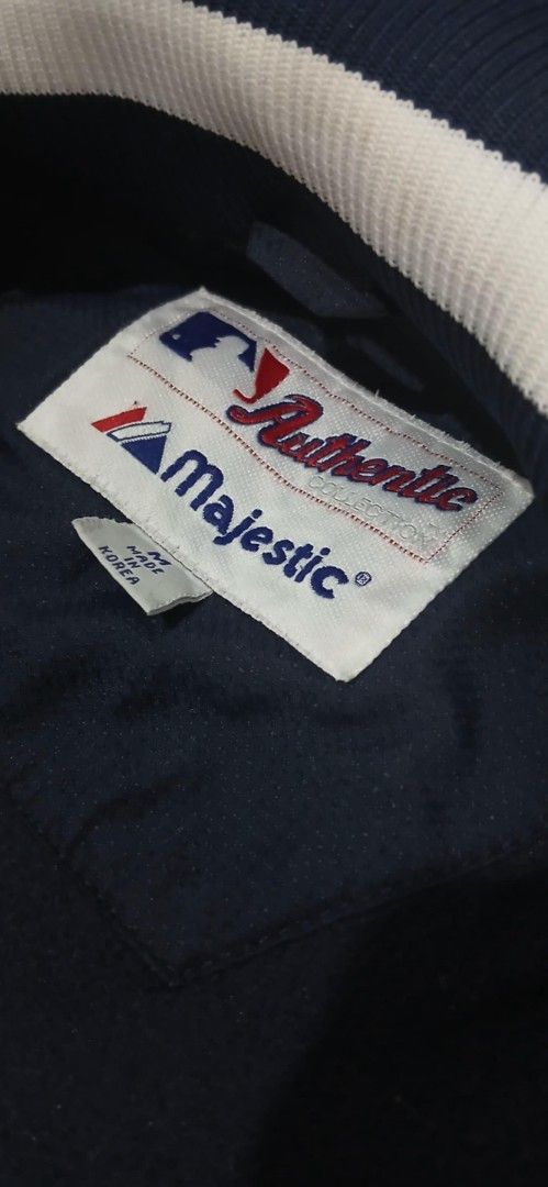 Majestic New York Yankees Jacket (Category: Coats, Jackets and Outerwear) located in Manila. Submitted by suyomjrsam92689 (Listing ID 1434524510, Image 3). Description: - Authentic Majestic New York Yankees jacket - Navy blue exterior with white accents - Prominent Yankees logo on chest and sleeve - Full zip closure - Made in Korea.