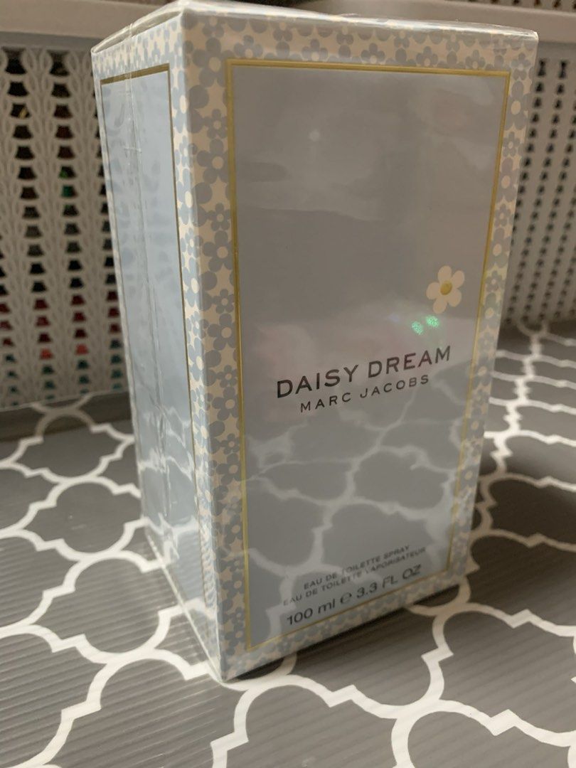 Marc Jacobs Daisy Dream Eau de Toilette 100ml (Category: Fragrance & Deodorants) located in Manila. Submitted by jstyle11 (Listing ID 1434580764, Image 2). Description: - Brand new, sealed Daisy Dream by Marc Jacobs from Australia - Eau de Toilette spray. - 100ml bottle. - Features the signature light blue and white floral box design. - Still in original packaging. .