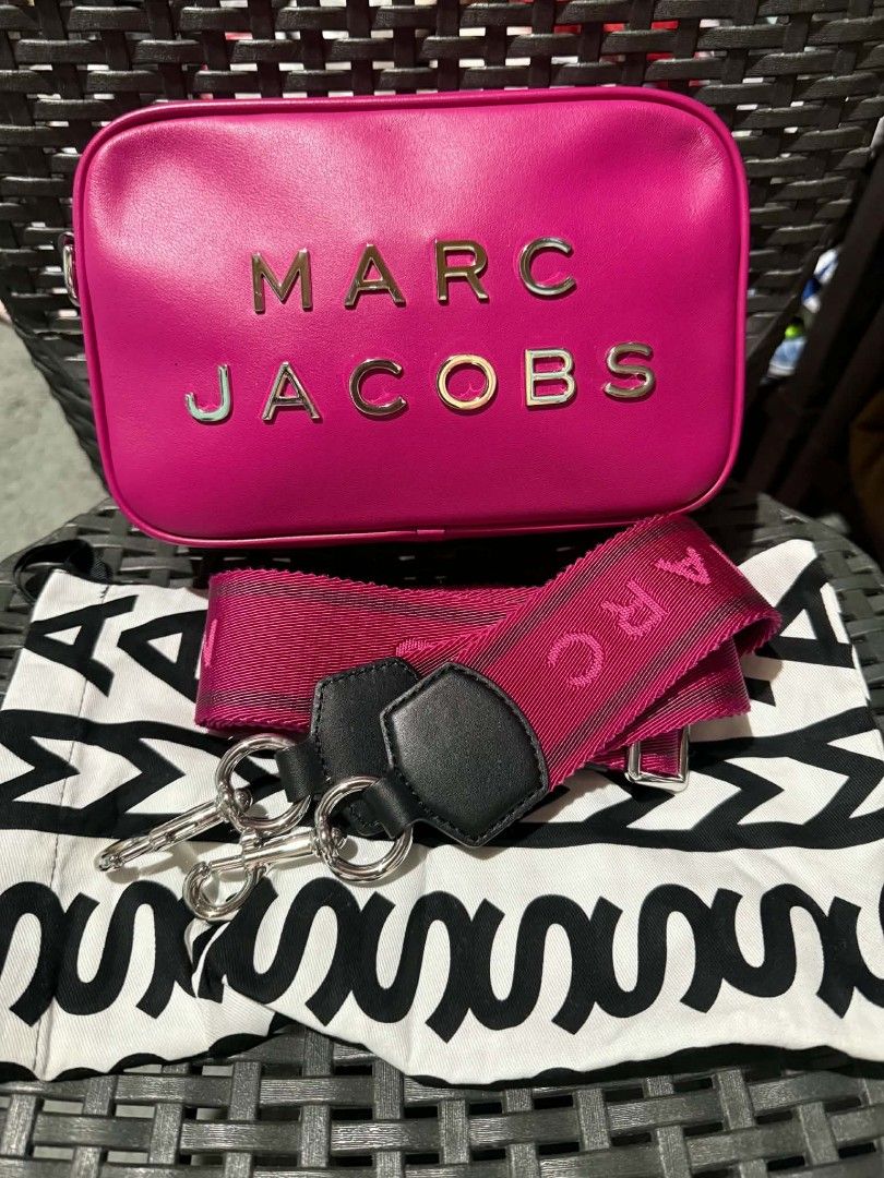 Marc Jacobs The Box Bag (Category: Luxury Bags & Wallets) located in Manila. Submitted by epiclion-c7dd (Listing ID 1434531522, Image 2). Description: - Authentic Marc Jacobs The Box Bag - Eye-catching pink crossbody bag - Bold Marc Jacobs branding on the front - Matching pink strap with brand detailing - Elegant silver-tone hardware - Includes original dust bag.