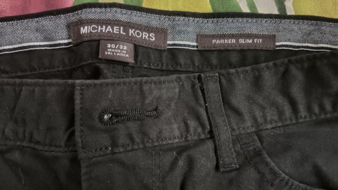 Michael Kors Parker Slim Fit Pants (Category: Jeans) located in Rizal. Submitted by luckyfox.3ba137 (Listing ID 1434428763, Image 2). Description: - Michael Kors Parker Slim Fit pants - Color: Black - Size: 30/32 - Features a button closure - Slim fit design - Made in Sri Lanka - Classic and versatile.