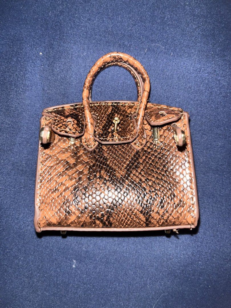 Mini Birkin Bag Charm Keychain (Category: Luxury Bags & Wallets) located in Asingan. Submitted by janellemaye (Listing ID 1434439579, Image 1). Description: What you see is what you get. Just arrived today. RFS: wrong color MOP: Gcash Loc: Pangasinan Ship via J&T or Flash Express.