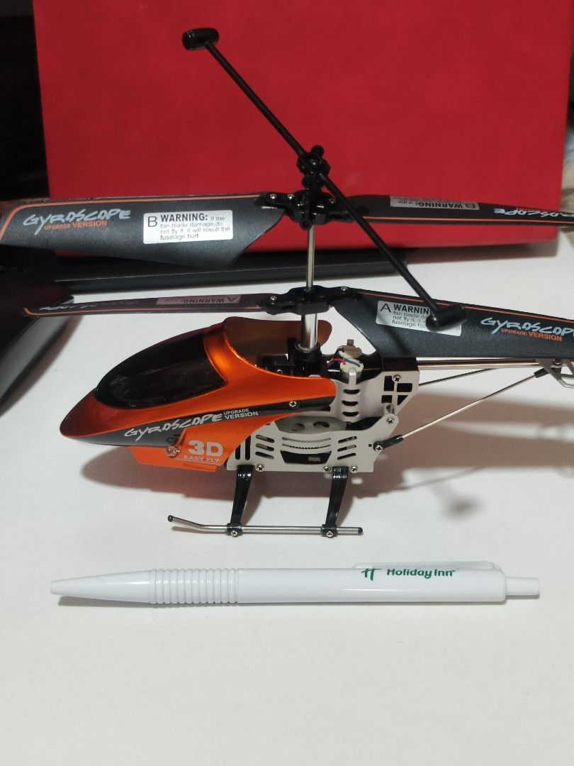 Mini RC Helicopter (Category: Remote Control Toys) located in Makati City. Submitted by franco31 (Listing ID 1434417983, Image 2). Description: For RC Heli hobbyist: Full aluminum metal frame, just need to replace 3.7V LiPo battery, to make it run again. No issues, very stable flight. Includes plastic case box to keep it secure..