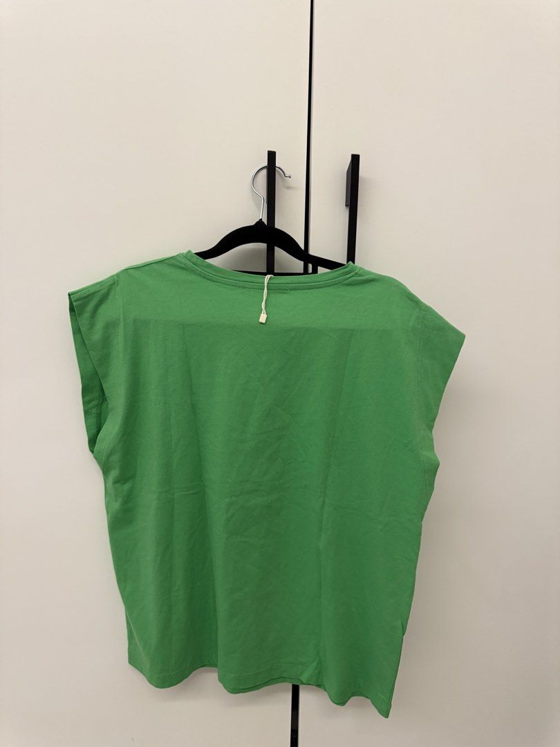MNG Green T-shirt - Size L (Category: Shirts) located in Manila. Submitted by sofffdlr (Listing ID 1434519421, Image 2). Description: - MNG t-shirt - Bright green color - Size: L - Features a crew neck - Cap sleeves - Unique seam detail on the chest .