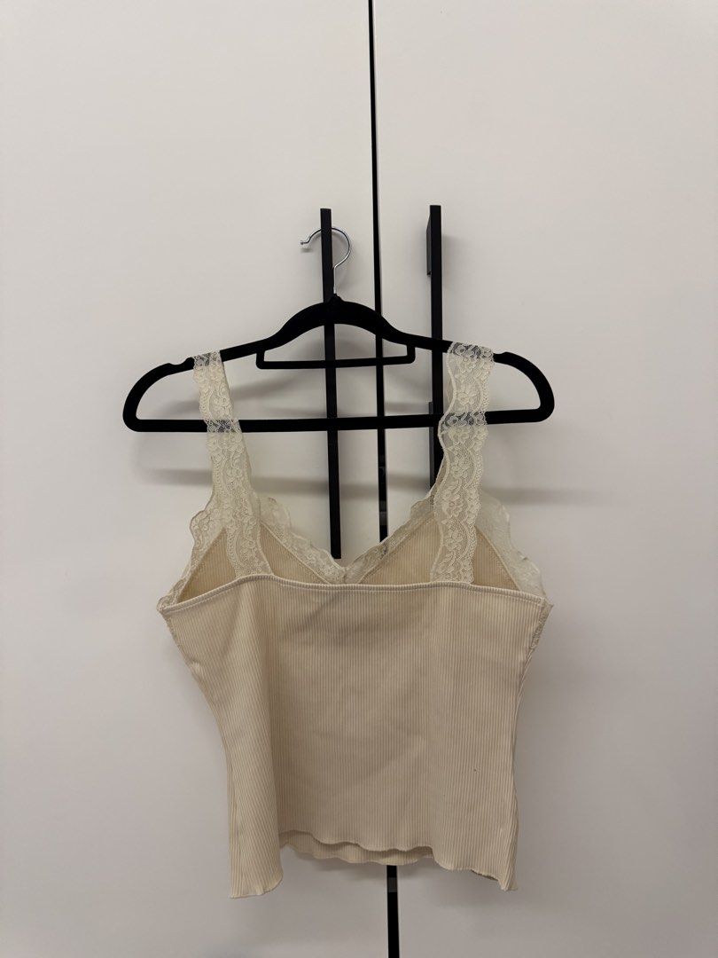 MNG Ribbed Tank Top with Lace (Category: Sleeveless) located in Manila. Submitted by sofffdlr (Listing ID 1434520721, Image 3). Description: - MNG tank top - Ribbed design - Lace detailing on straps and neckline - V-neck - Neutral color - Great for layering or wearing alone.