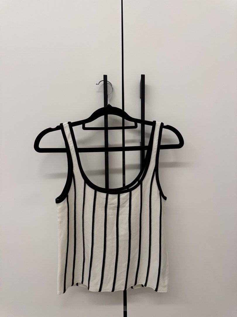 MNG Striped Tank Top (Category: Sleeveless) located in Manila. Submitted by sofffdlr (Listing ID 1434520352, Image 2). Description: - MNG tank top - Size M - Black and white striped design - Scoop neckline - Versatile style.