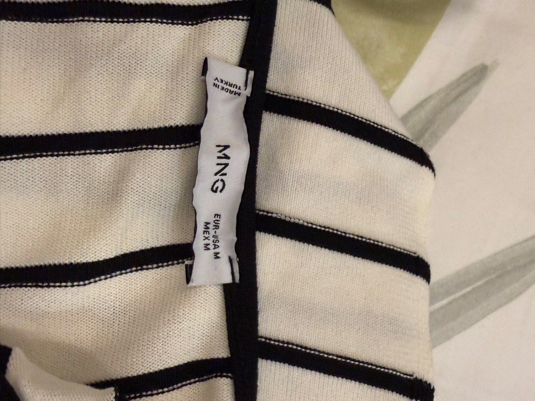 MNG Striped Tank Top (Category: Sleeveless) located in Manila. Submitted by sofffdlr (Listing ID 1434520352, Image 3). Description: - MNG tank top - Size M - Black and white striped design - Scoop neckline - Versatile style.