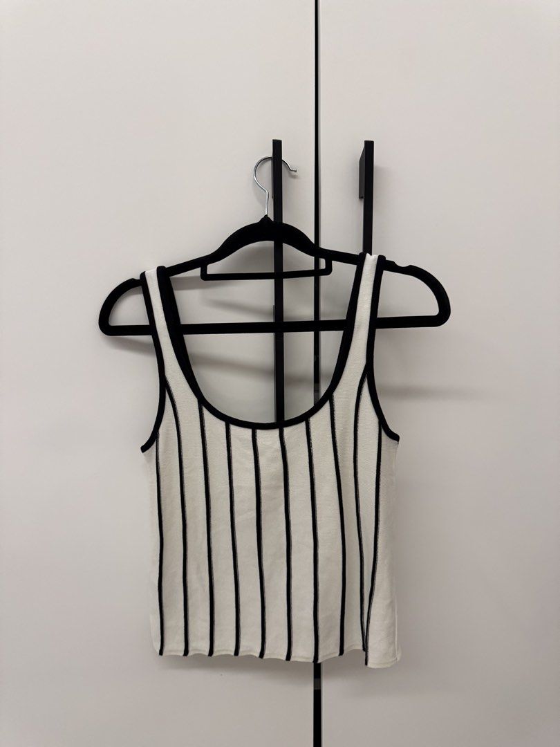 MNG Striped Tank Top (Category: Sleeveless) located in Manila. Submitted by sofffdlr (Listing ID 1434520352, Image 1). Description: - MNG tank top - Size M - Black and white striped design - Scoop neckline - Versatile style.