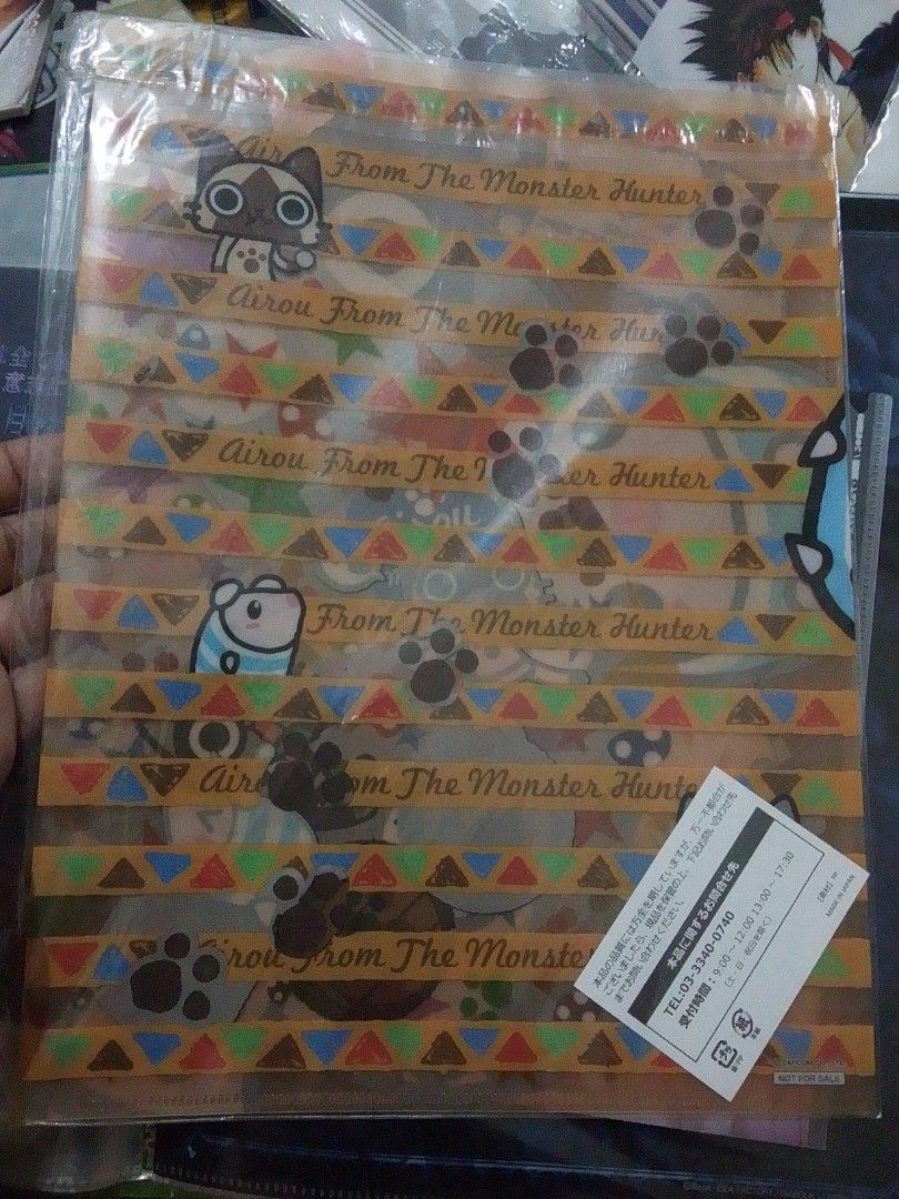 Monster Hunter Airou Folder (Category: Stationery & School Supplies) located in Santa Rosa. Submitted by animemerchcollection (Listing ID 1434566990, Image 1). Description: - New and unused Airou Monster Hunter folder. - Features a colorful design. - Includes paw prints and geometric patterns. - Ideal for organizing papers and documents. - A must-have for any Monster Hunter enthusiast..