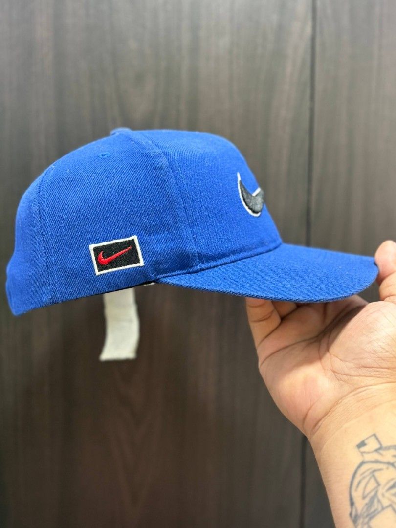 Vintage Nike Cap (Category: Caps & Hats) located in Quezon City. Submitted by trellzilla666 (Listing ID 1434527281, Image 2). Description: - Blue Nike cap - Nike logo on front and back - Curved brim - Adjustable strap - Durable material - Nike tag inside.