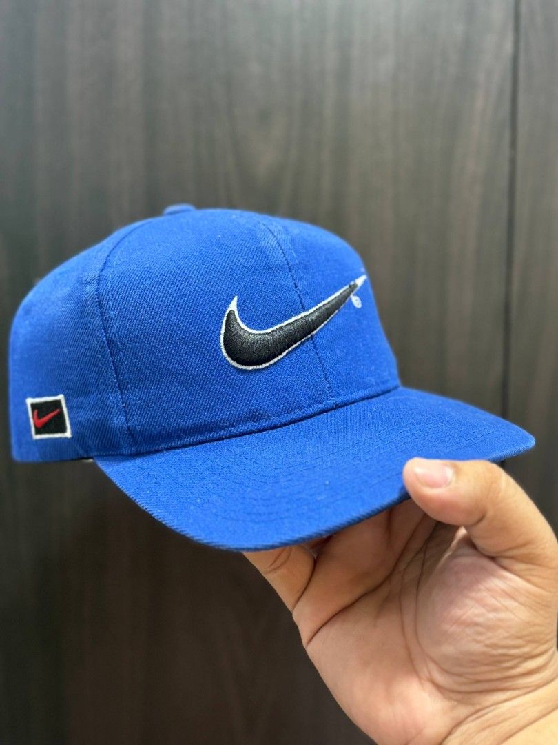 Vintage Nike Cap (Category: Caps & Hats) located in Quezon City. Submitted by trellzilla666 (Listing ID 1434527281, Image 1). Description: - Blue Nike cap - Nike logo on front and back - Curved brim - Adjustable strap - Durable material - Nike tag inside.