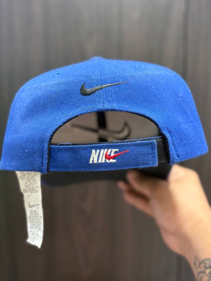 Vintage Nike Cap (Category: Caps & Hats) located in Quezon City. Submitted by trellzilla666 (Listing ID 1434527281, Image 3). Description: - Blue Nike cap - Nike logo on front and back - Curved brim - Adjustable strap - Durable material - Nike tag inside.