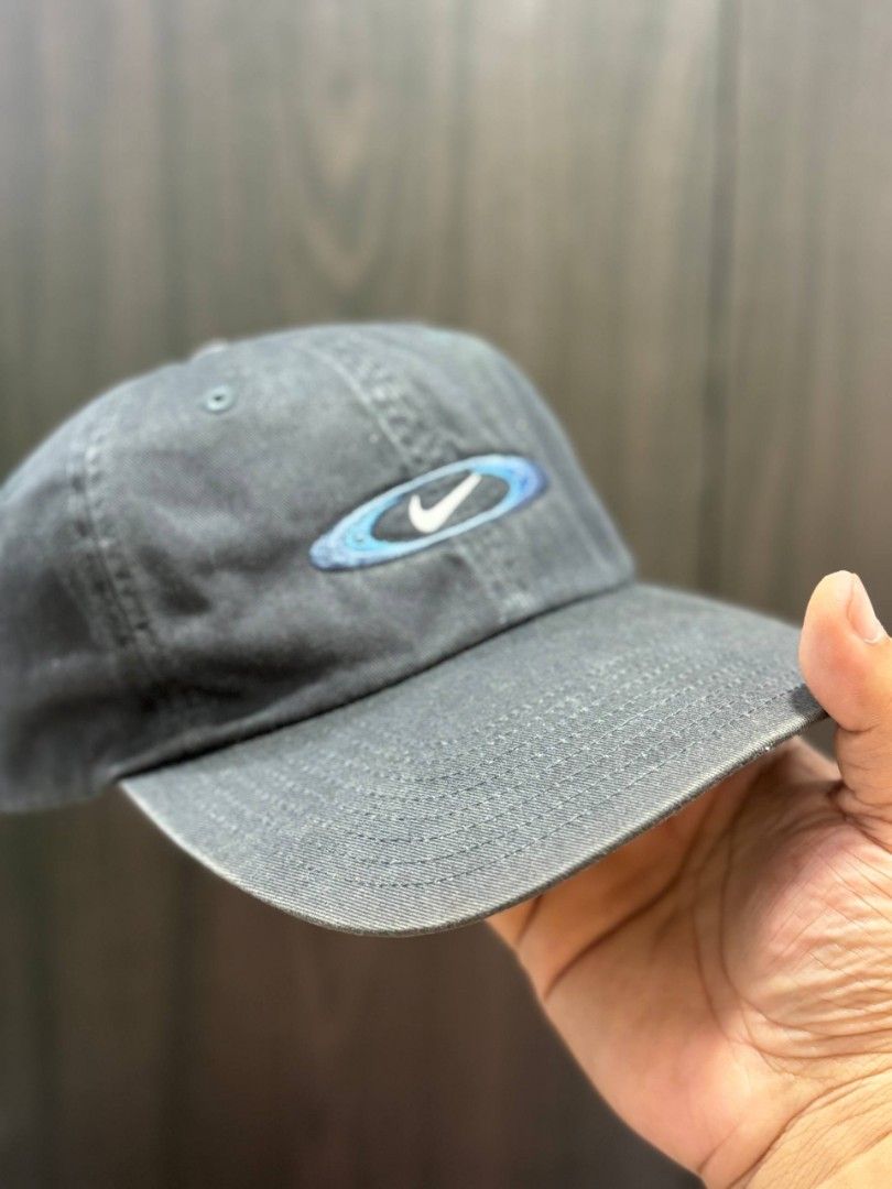 Nike Cap (Category: Caps & Hats) located in Quezon City. Submitted by trellzilla666 (Listing ID 1434527274, Image 1). Description: - Nike cap with a unique blue and white logo. - Nike logo on the back. - Adjustable strap for a perfect fit. - Made of durable material, ideal for everyday wear..