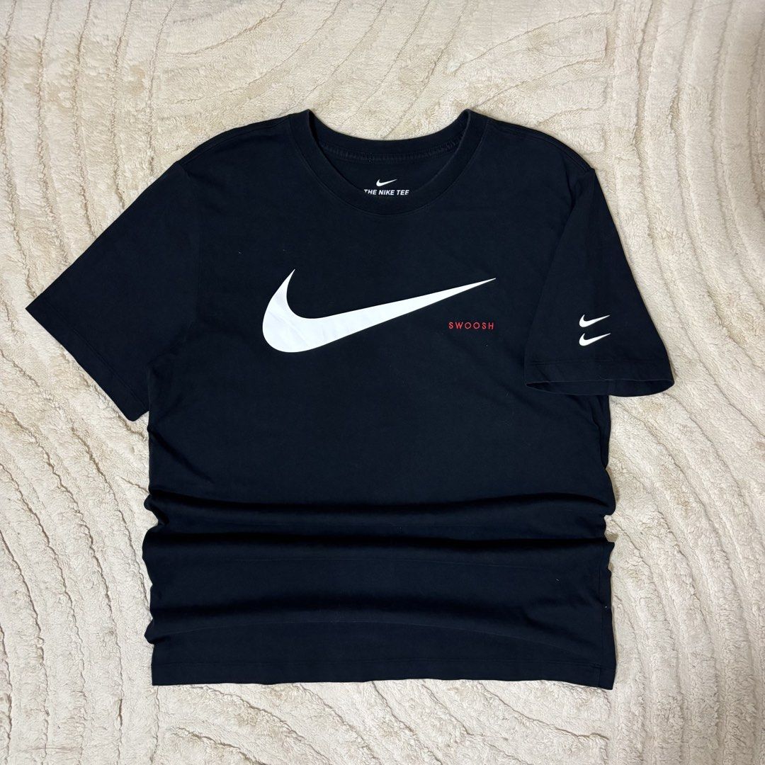 Nike Double Swoosh T-shirt (Category: Tshirts & Polo Shirts ) located in Quezon City. Submitted by grailph (Listing ID 1434558587, Image 2). Description: - Nike double swoosh t-shirt - Features a large white Swoosh logo on the front - Includes a smaller Swoosh on the sleeve - "SWOOSH" text in red below the logo - Size: Large on tag - 20” x 27” Dimension - Material: 100% cotton - Color rate 9/10 No issue.