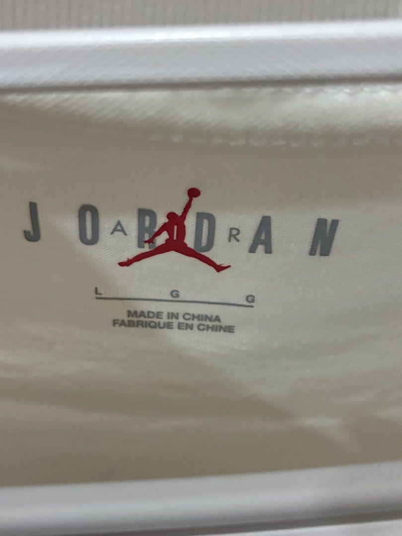 Nike Jordan Graphic T-shirt (Category: Tshirts & Polo Shirts ) located in Makati City. Submitted by lps.ph (Listing ID 1434451216, Image 2). Description: - Nike Jordan T-shirt - Features a graphic of Michael Jordan - Classic crew neck and short sleeves - Color: White - Graphic: Multi-colored on the front - Nike logo visible - Made in China.