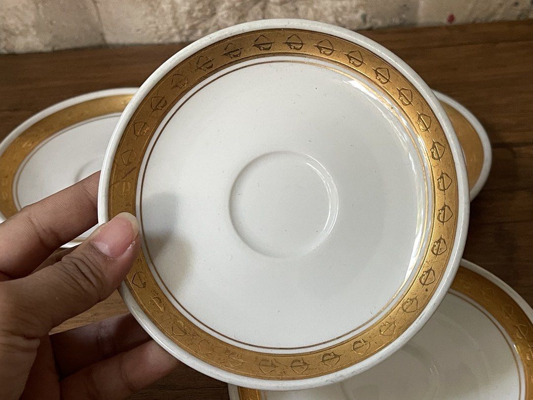 Noritake Primadura Saucers (Category: Coffee & Tea Tableware) located in San Fernando. Submitted by japansurpluselyu (Listing ID 1434583272, Image 2). Description: - Set of four Noritake Primadura saucers - Features a white base - Elegant gold rim and accents - Marked "Ultra-Hard Porcelain Japan" - Perfect for tea or coffee service.