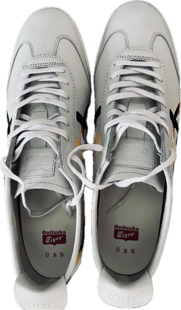 Onitsuka Tiger Mexico 66 White Sneakers (Category: Dress Shoes) located in Singapore. Submitted by cwgp2sxgyn (Listing ID 1434451609, Image 1). Description: - Colour not available in SG store, bought from Japan - Wore once - Onitsuka Tiger Mexico 66 sneakers - White colorway - Black and gold stripes - Made in Japan - Size: US 11.5, EU 46, CM 29.
