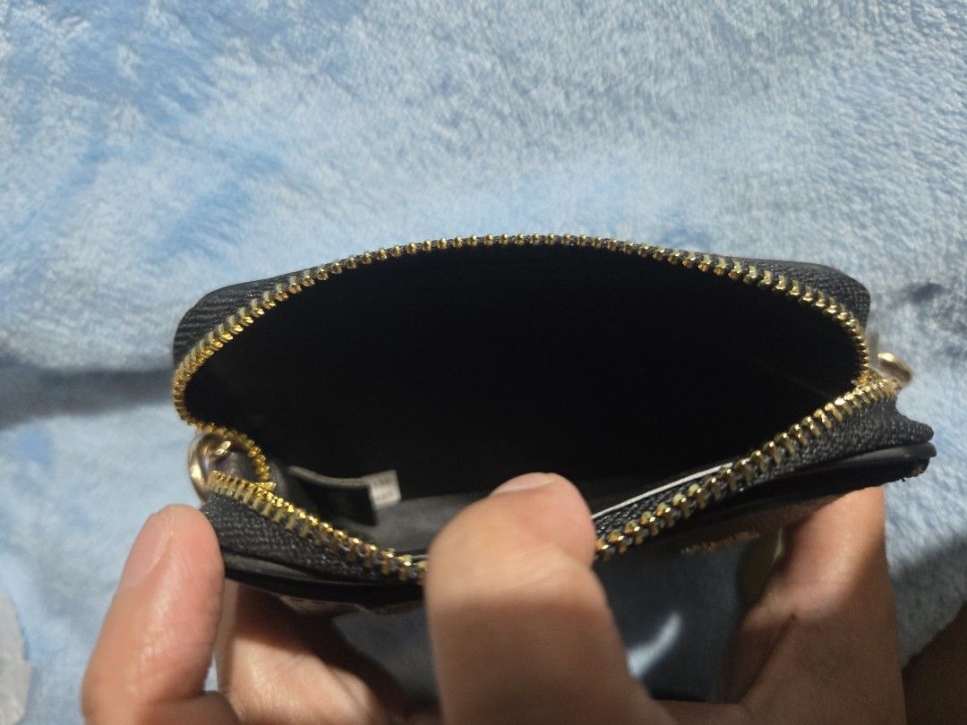 Original Coach Cardholder with Chain (Category: Luxury Bags & Wallets) located in Manila. Submitted by ms.rusell (Listing ID 1434538254, Image 3). Description: - Coach cardholder - Signature logo pattern - Includes a chain - Zippered compartment - Clear ID window - Color: Black and Brown - Condition: Good.