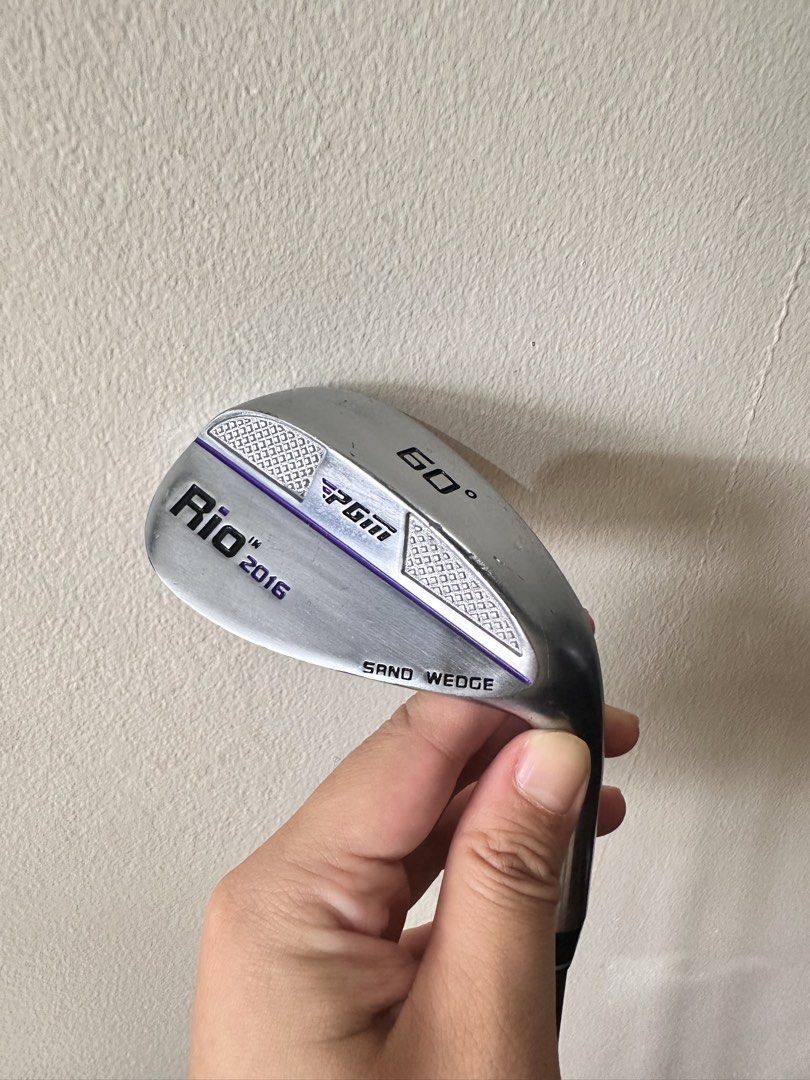 PGM Rio 2016 60 Degree Sand Wedge (Category: Golf) located in Quezon City. Submitted by golfstuffmaybe (Listing ID 1434415647, Image 1). Description: - PGM Rio 2016 sand wedge - 60-degree loft - Black grip with PGM logo - Silver shaft - Silver head - Head marked "SAND WEDGE".