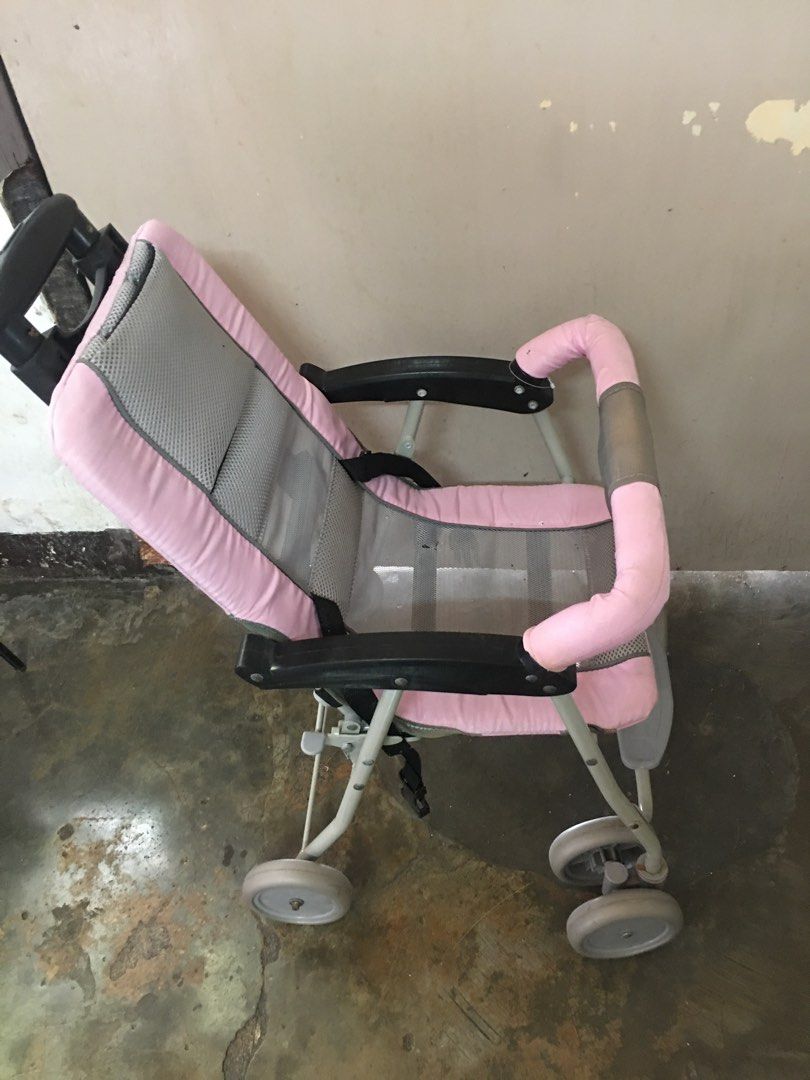 Pink Baby Stroller (Category: Strollers) located in Marikina City. Submitted by cantalejoy86806 (Listing ID 1434397554, Image 3). Description: - Pink and gray color scheme - Easy-to-push handle - Safety harness for secure seating - Four wheels for stability - Includes a footrest - Lightweight and foldable for easy storage and transport.