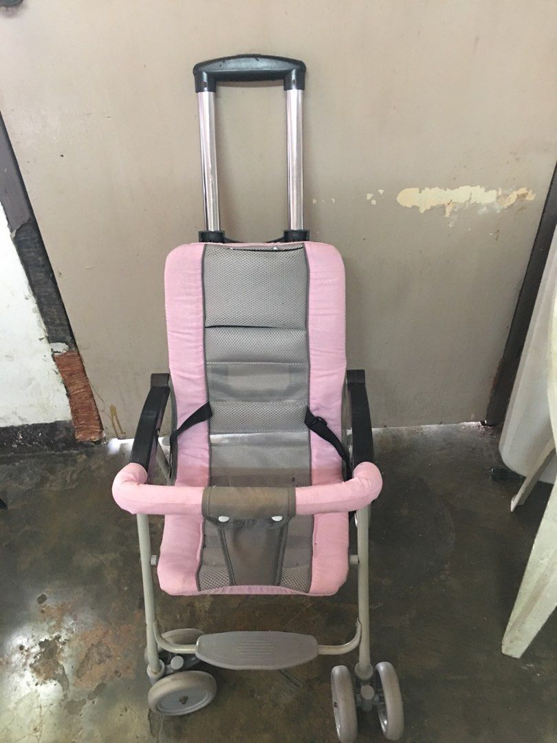 Pink Baby Stroller (Category: Strollers) located in Marikina City. Submitted by cantalejoy86806 (Listing ID 1434397554, Image 1). Description: - Pink and gray color scheme - Easy-to-push handle - Safety harness for secure seating - Four wheels for stability - Includes a footrest - Lightweight and foldable for easy storage and transport.