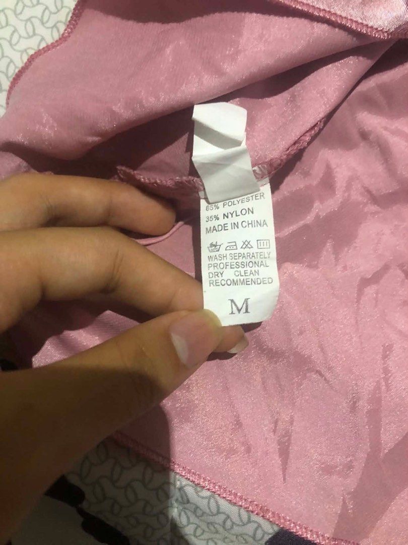 Pink Satin Dress - Size M (Category: Dresses) located in Manila. Submitted by pearlyshell.brb (Listing ID 1434488472, Image 3). Description: - Pink satin strapless dress - Size: M - Design: Tie-up straps - Fabric: 65% Polyester, 35% Nylon - Care Instructions: Wash separately, dry clean only.