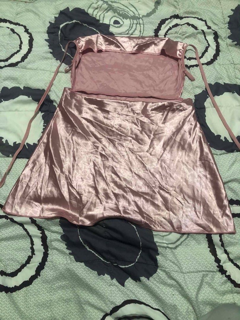 Pink Satin Dress - Size M (Category: Dresses) located in Manila. Submitted by pearlyshell.brb (Listing ID 1434488472, Image 2). Description: - Pink satin strapless dress - Size: M - Design: Tie-up straps - Fabric: 65% Polyester, 35% Nylon - Care Instructions: Wash separately, dry clean only.