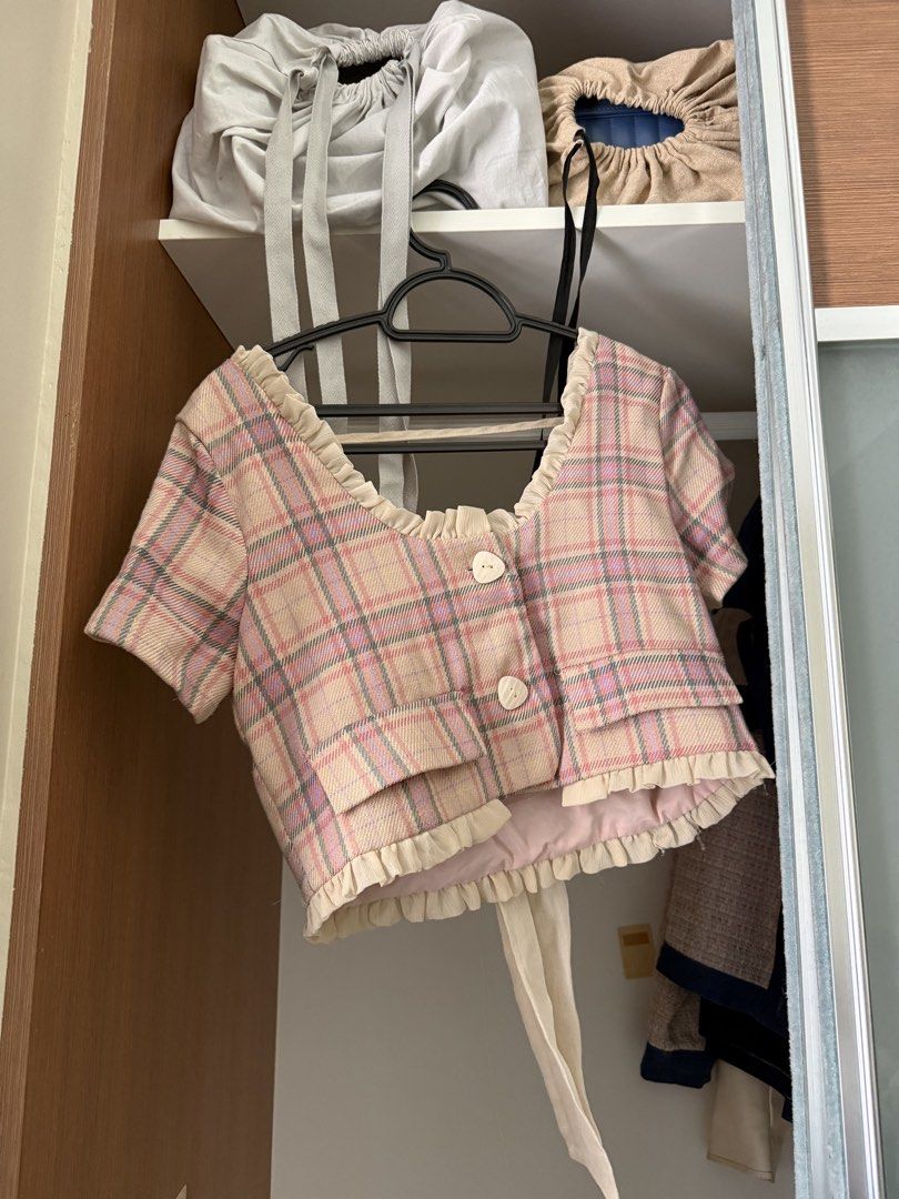 Plaid Crop Top and Skirt Set (Category: Sets or Coordinates) located in Mandaluyong City. Submitted by komatiite (Listing ID 1434468629, Image 3). Description: - Adorable plaid crop top and skirt set. - Top features: - Square neckline - Ruffle trim - Button details - Bow tie back - Skirt is a wrap style with tie closure. - Great for casual wear or special occasions..