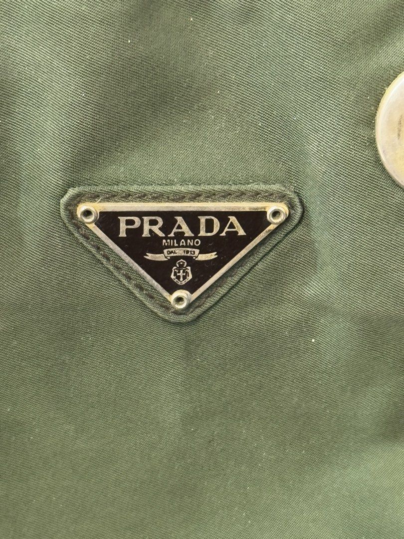 PRADA authentic green tessuto nylon chain small shoulder bag (Category: Luxury Bags & Wallets) located in Cainta. Submitted by houseofcarry (Listing ID 1282960357, Image 3). Description: PRADA tessuto nylon chain shoulder bag ⚜️ Guaranteed authentic 💯 Money-back guarantee if proven otherwise ⚜️ Comes with a generic dust bag only ⚜️ Please note: Minor discoloration on the interior due to age. Kindly refer to the last photos for condition details.