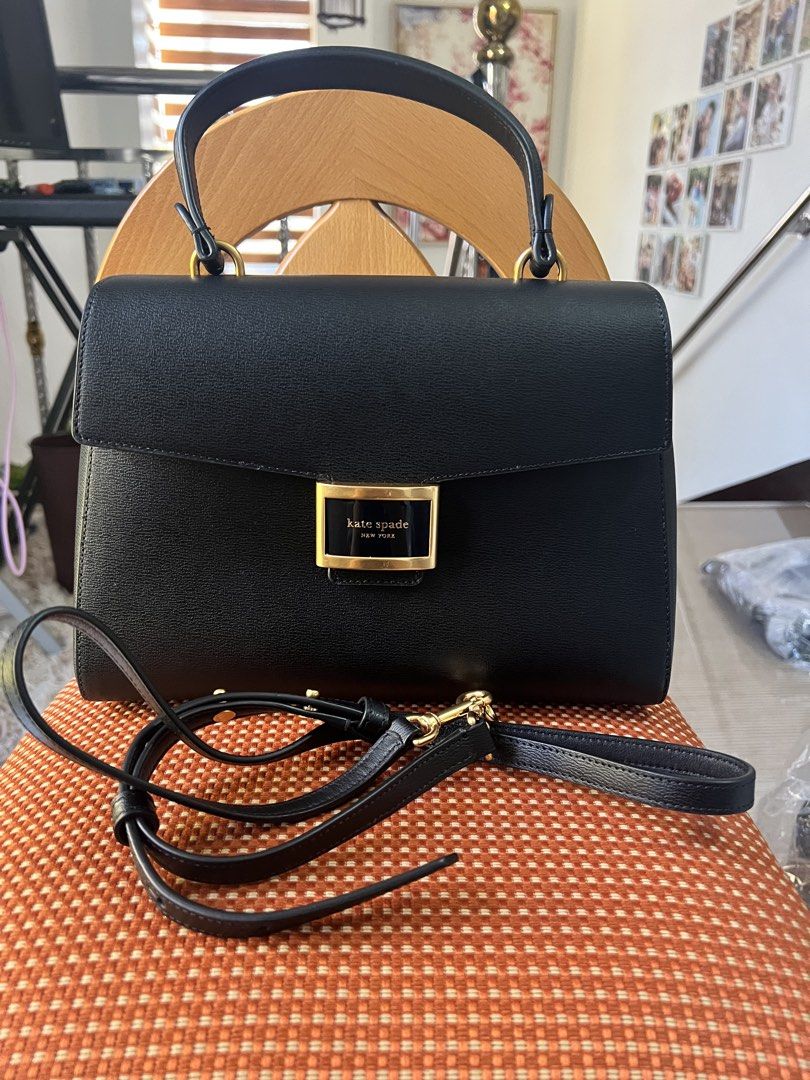 PRELOVED Kate Spade Katy Medium Top Handle - Black (Category: Luxury Bags & Wallets) located in San Pedro. Submitted by misslumi (Listing ID 1434600460, Image 1). Description: PRELOVED Kate Spade Katy Medium Top Handle - Black. Retail bag! With minimal flaws, stain on inner flap (see photos) and lining. What you see is what you get. Fits large wallet and any phone sizes..