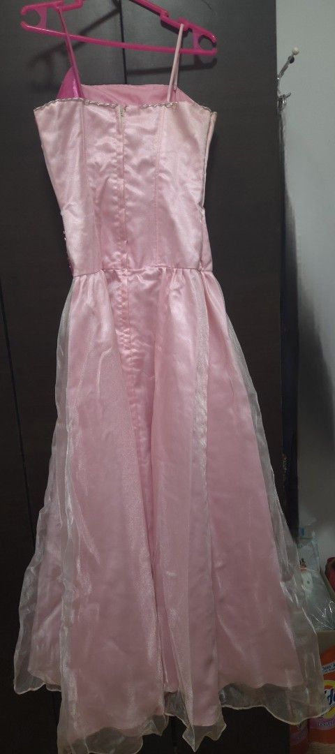 Pre-loved Pink Formal Dress (Category: Dresses) located in Pasig City. Submitted by whitepaws.b278660 (Listing ID 1434464874, Image 2). Description: - Pink formal dress - Fitted bodice with beaded accent - Spaghetti straps - Floor-length, flowing skirt - Zipper closure - Ideal for special occasions -With issues as seen in pictures -Needs washing -Price negotiable Payment first before arranging shipment Price posted does not include shipping No pa