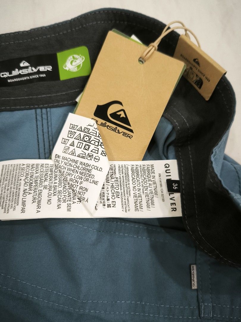 Quiksilver Board Shorts - Size 36 (Category: Swim Trunks & Board Shorts) located in Pasig City. Submitted by keibee14 (Listing ID 1434548223, Image 2). Description: - Quiksilver board shorts - Color: Teal - Size: 36 - Features: Cargo pockets (both sides), drawstring closure - Includes: Original tags - Made in: Vietnam - Condition: Minor tiny white spot present at the back near bottom (refer to last photo) due to storage. I think it can be removed