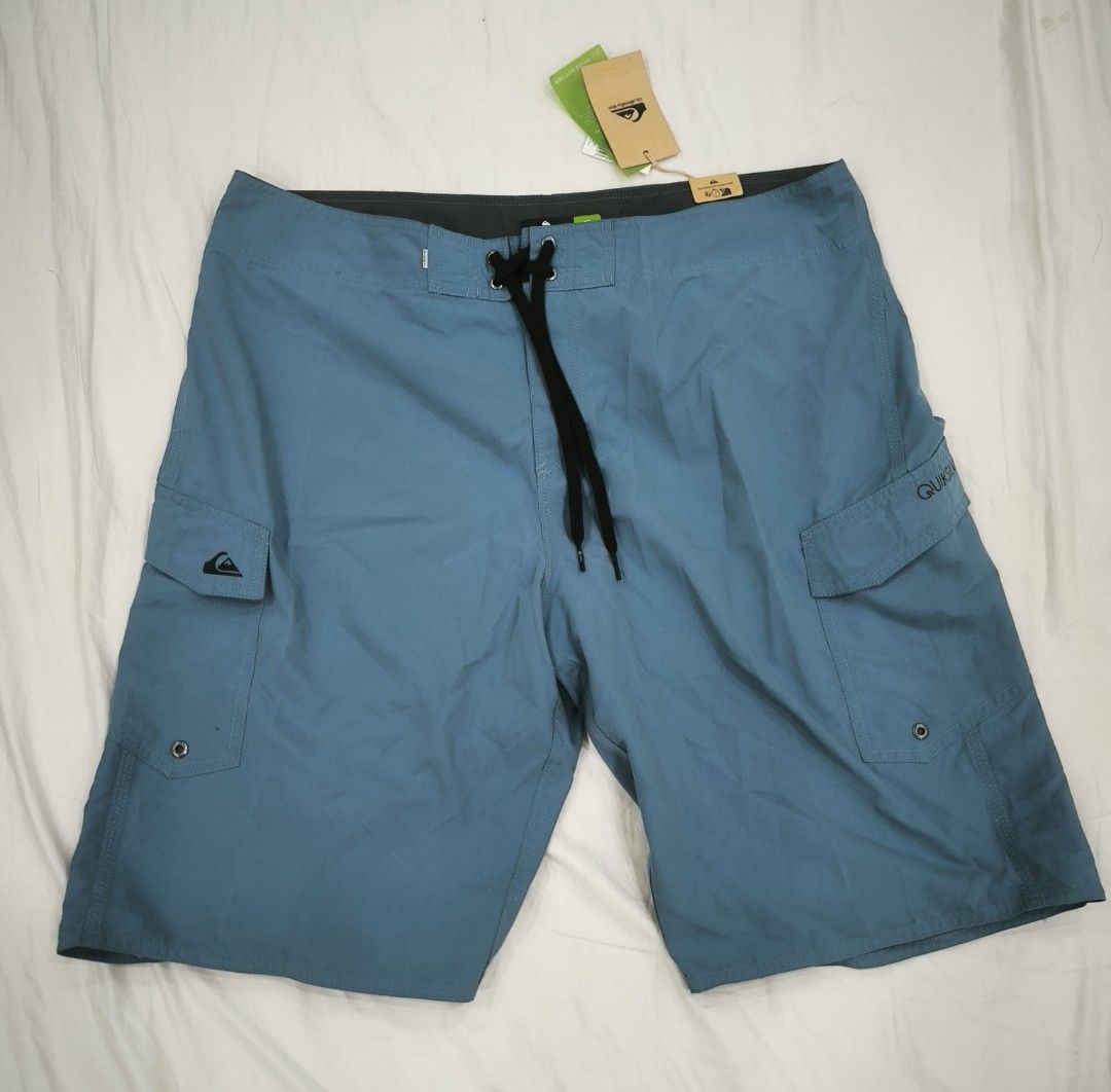 Quiksilver Board Shorts - Size 36 (Category: Swim Trunks & Board Shorts) located in Pasig City. Submitted by keibee14 (Listing ID 1434548223, Image 1). Description: - Quiksilver board shorts - Color: Teal - Size: 36 - Features: Cargo pockets (both sides), drawstring closure - Includes: Original tags - Made in: Vietnam - Condition: Minor tiny white spot present at the back near bottom (refer to last photo) due to storage. I think it can be removed
