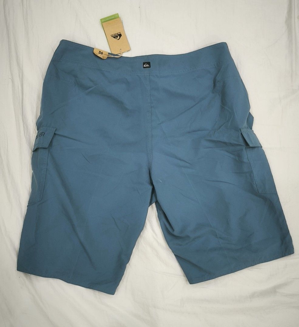 Quiksilver Board Shorts - Size 36 (Category: Swim Trunks & Board Shorts) located in Pasig City. Submitted by keibee14 (Listing ID 1434548223, Image 3). Description: - Quiksilver board shorts - Color: Teal - Size: 36 - Features: Cargo pockets (both sides), drawstring closure - Includes: Original tags - Made in: Vietnam - Condition: Minor tiny white spot present at the back near bottom (refer to last photo) due to storage. I think it can be removed