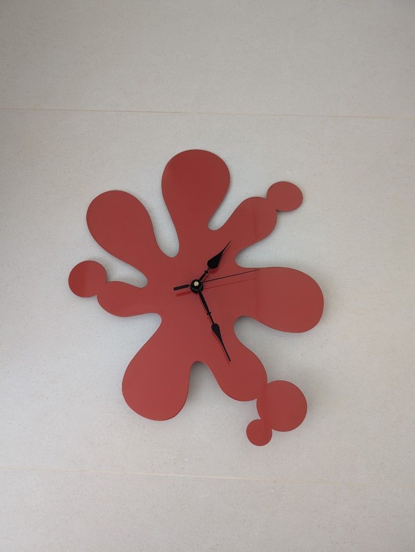 Wall Clock (Category: Clocks) located in Singapore. Submitted by carefree18 (Listing ID 1434485869, Image 1). Description: - Unique red splatter design - Modern, abstract style - Number free, so it can be placed in any direction - Easy-to-read black hands - Battery-operated (AA battery) - Adds personality to any room.