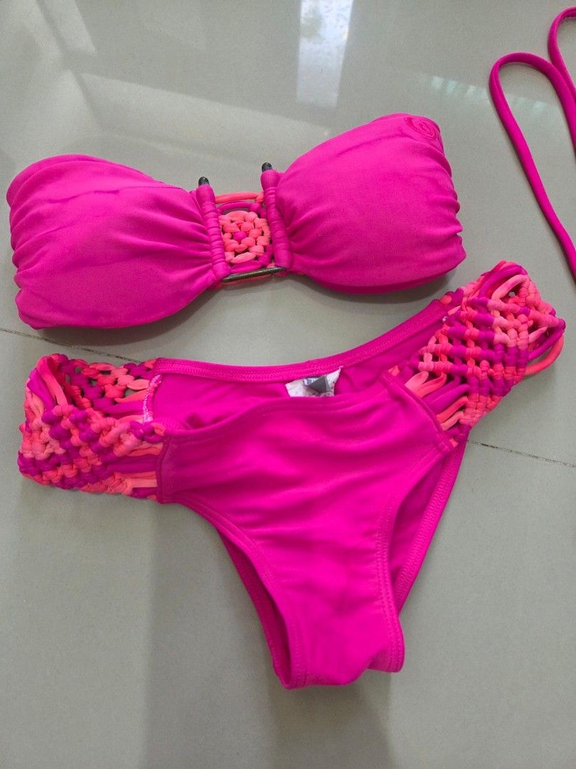 Rip Curl Macramé Bikini Set - Fuchsia Pink (Category: Bikinis & Swimsuits) located in Bacolod City. Submitted by maraline (Listing ID 1432815753, Image 3). Description: ​Brand: Rip Curl ​Size: Tagged as a Size 6 (Fits XS-SMALL) ​Fabric: 80% Polyamide, 20% Lycra (Standard high-quality swimwear stretch). ​Design: Bandeau-style top with macramé center and side detailing; cheeky/standard bottoms with matching macramé hip straps and a "scrunch butt" (
