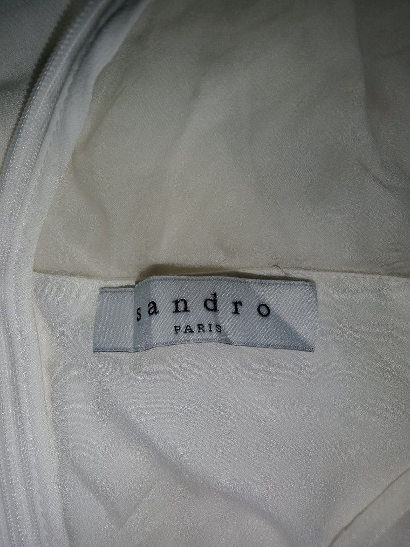 Sandro Paris White Cutout Dress (Category: Dresses) located in San Pedro. Submitted by eye_spy (Listing ID 1434515387, Image 2). Description: -Authentic Sandro Paris white dress - Features a cutout back design - Sheer neckline - Zipper closure - Lightweight fabric - Perfect for warm weather - Ideal for special occasions or nights out size: xs-small.