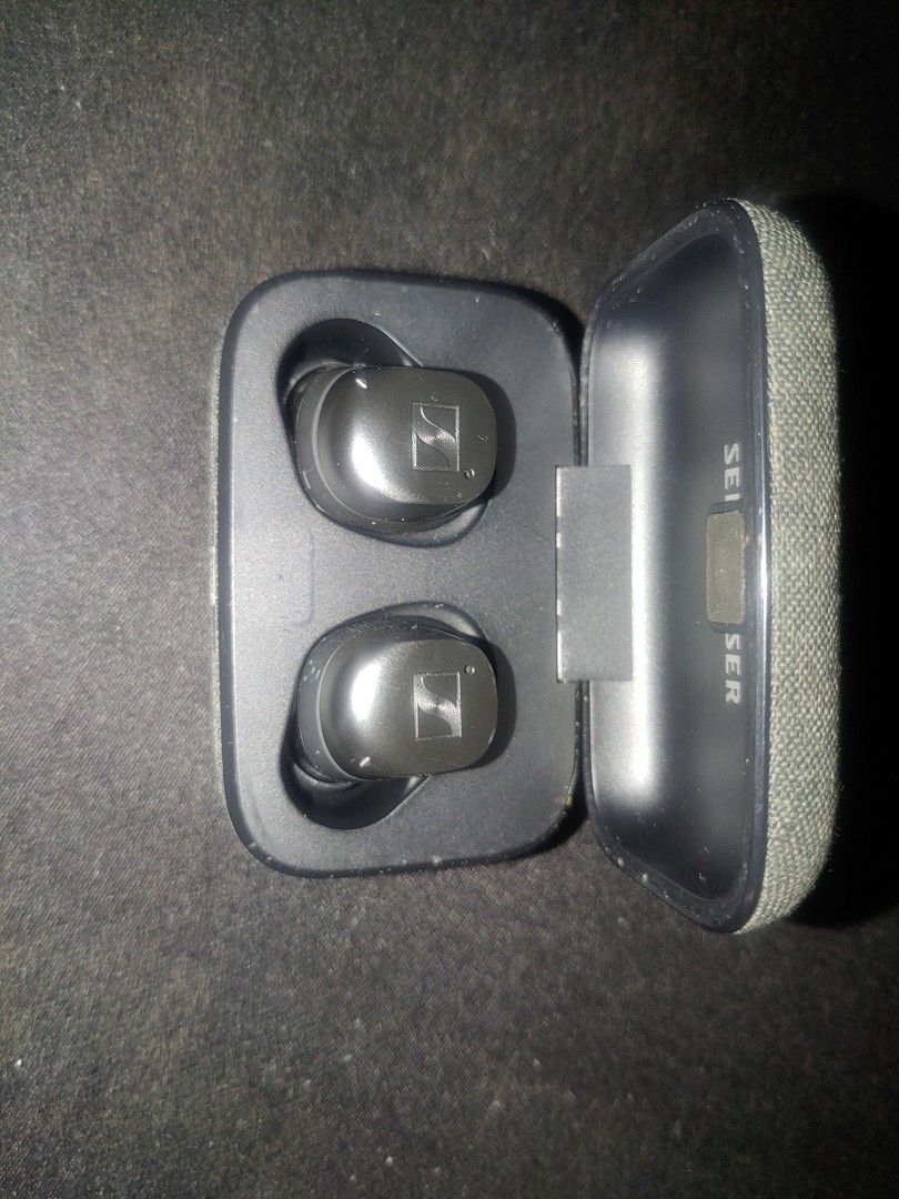 Sennheiser True Wireless Earbuds TW3 (Category: Earphones) located in Makati City. Submitted by jrguy8 (Listing ID 1434400146, Image 1). Description: issue is battery life of right bud is 30 minutes. - Sennheiser MTW3 True Wireless Earbuds - Color: Black earbuds, Gray charging case - Condition: Good - Charging Case: USB-C port.