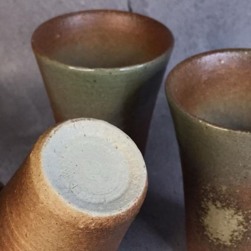 Set of Stoneware Tumblers (Category: Coffee & Tea Tableware) located in Bulacan. Submitted by ceramicscubby (Listing ID 1434579920, Image 3). Description: 🥢 Size: 3.3 D x 4.8 H in. ❗️CLOSING DOWN SALE, ALL PRICES ARE MARKED DOWN. WE WILL NOT BE ACCEPTING OFFERS LOWER THAN OUR ASKING PRICE. ❗️ - Set of three handmade ceramic cups - Unique color gradient: light green to warm brown - Textured surface - Distinctive design - Stamped bottoms.