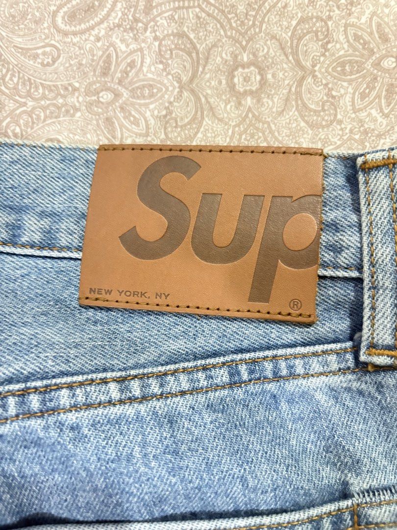 Supreme selvedge stonewashed jeans (Category: Jeans) located in Marikina City. Submitted by surity99 (Listing ID 1434495419, Image 3). Description: - Supreme slim fit jeans - stonewashed - Size 30 - Button fly - Red Supreme tag - Leather patch with Supreme logo - Made in Japan - Red selvedge detail - Material: 100% cotton, cow leather patch Waist 16 in Rise 11 in Inseam 29 in (chainstitch hemmed) Hem width 7.9 in.