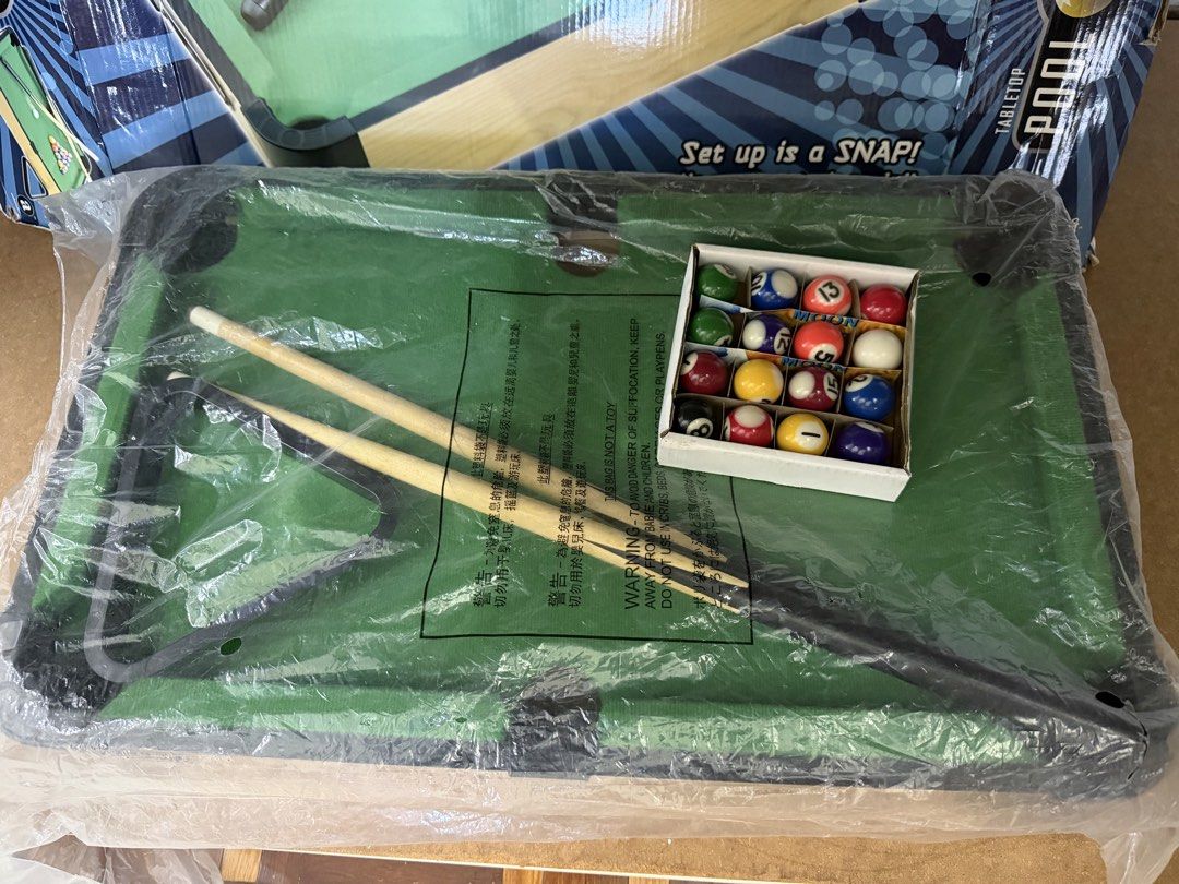 Tabletop Pool Set (Category: Kids Toys) located in Subang Jaya. Submitted by shine2234 (Listing ID 1434451622, Image 2). Description: - Mini tabletop pool set - Includes pool table, cues, and balls - Easy to set up (no tools needed) - Perfect for fun with friends and family - From Toys R Us.
