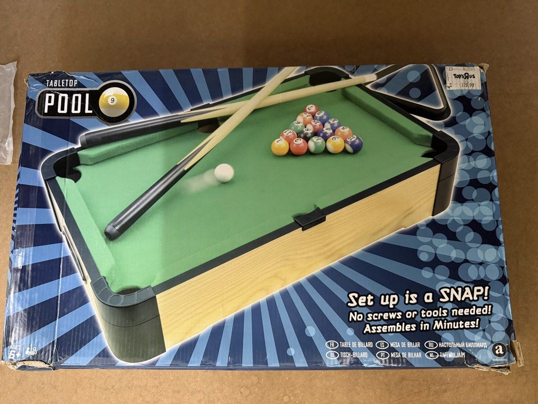 Tabletop Pool Set (Category: Kids Toys) located in Subang Jaya. Submitted by shine2234 (Listing ID 1434451622, Image 1). Description: - Mini tabletop pool set - Includes pool table, cues, and balls - Easy to set up (no tools needed) - Perfect for fun with friends and family - From Toys R Us.