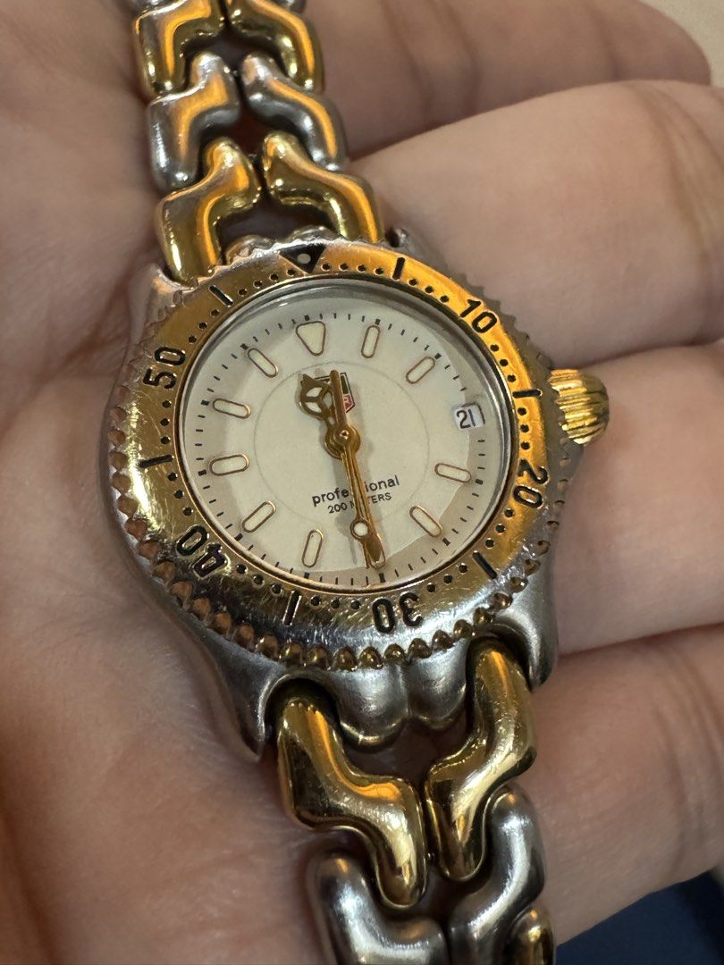 Tag Heuer Two Toned Ladies Watch (Category: Women's Watches) located in Taytay. Submitted by everythingonline888 (Listing ID 1434565137, Image 2). Description: - Tag Heuer Professional 200 Meters watch - Gold and silver-toned bracelet and bezel - White dial - Date display - Swiss made - Marked with "TAG HEUER" and "SWISS SINCE 1860" on the back No inclusions Signs of wear Slightly negotiable.