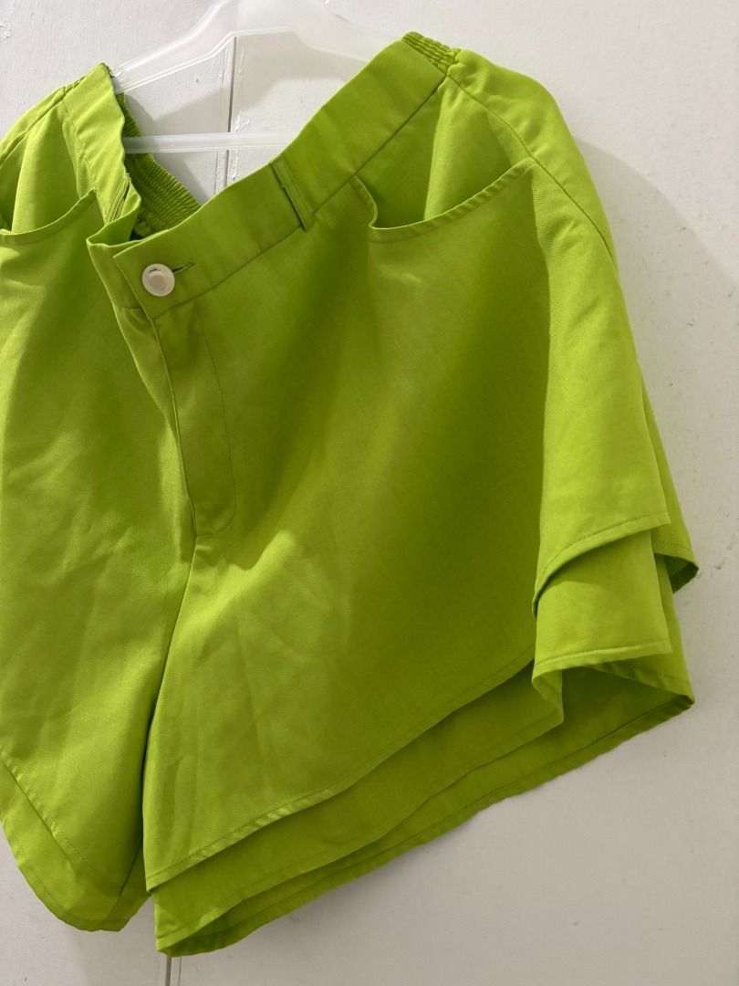 Tayo Studio Green Shorts (Category: Shorts) located in Manila. Submitted by aboutsammy (Listing ID 1434425636, Image 3). Description: - Bright green layered design - Elastic waistband - Button closure - Pockets - Comfortable fit - Still in good condition - Tayo Studio Size 4: Fits 3XL - 4XL Please note that the button has been replaced, not the original one. RFS: Decluttering na po, used once..