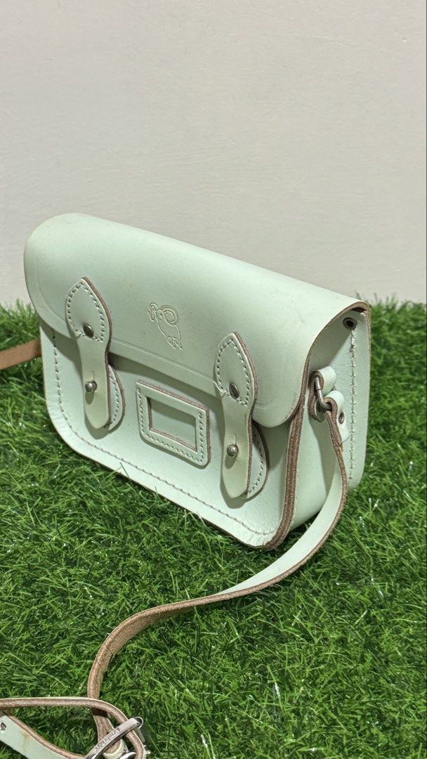 The Cambridge Satchel Mini Sling Bag with Aries Embossed Sign (Category: Cross-body Bags) located in Lingayen. Submitted by thrft.dpts (Listing ID 1434539678, Image 2). Description: The Cambridge Satchel Mini Sling Bag with Aries Embossed Sign Color: Mint Green.