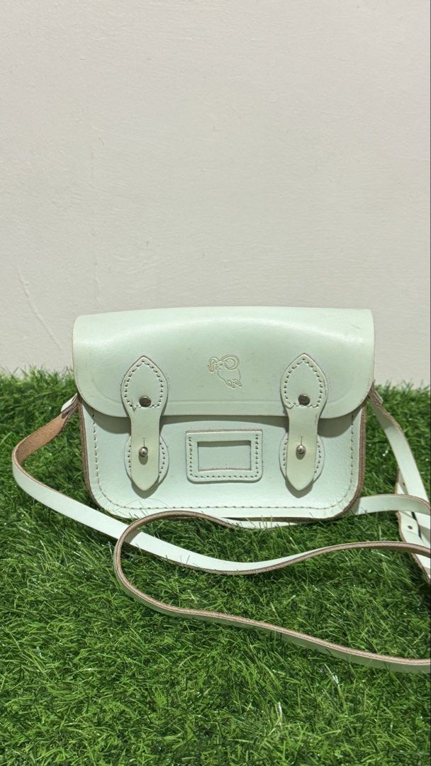 The Cambridge Satchel Mini Sling Bag with Aries Embossed Sign (Category: Cross-body Bags) located in Lingayen. Submitted by thrft.dpts (Listing ID 1434539678, Image 1). Description: The Cambridge Satchel Mini Sling Bag with Aries Embossed Sign Color: Mint Green.